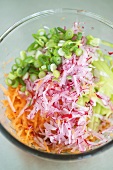 Grated vegetables in a dish to be used as wrap filling