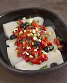 Cod with vegetables in a baking dish