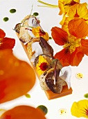 Fried goose liver with shellfish and edible flowers