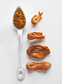 Mace and ground nutmeg on a porcelain spoon