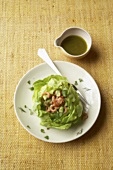 Avocado and shrimp salad on lettuce leaves with dressing