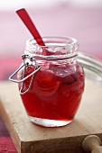 Apple and cranberry jelly in a preserving jar