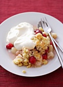 Cranberry crumble with whipped cream
