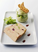 A slice of goose liver with bean salad and bean puree