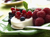 Panna cotta with raspberries, blueberries and redcurrants