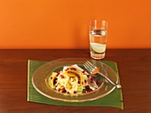 Sauerkraut salad with smoked trout and exotic fruit