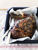 Roast leg of lamb in a roasting tin