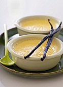 Two bowls of Oeufs au lait (Vanilla custard, France)