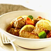 Veal goulash with tomatoes and lemon