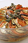 Baked tomato, aubergine and courgette slices in olive oil