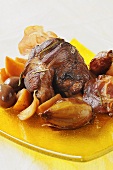 Lamb shank braised in red wine with turnips and olives