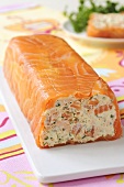 Smoked salmon terrine with a slice removed