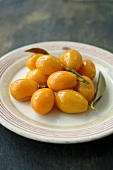Bottled kumquats on a plate