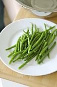 Several green beans on a plate