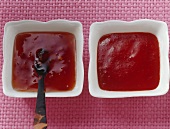 Two different chilli sauces in small dishes