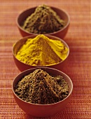 Ras el hanout, Madras curry powder, garam masala in small bowls