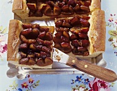 Tray-baked plum cake, pieces cut