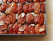 Dried tomatoes on a baking tray