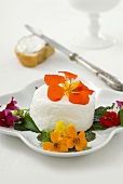 Fresh goat's cheese with edible flowers