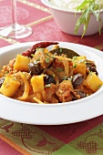 Braised lamb with vegetables, olives and tarragon