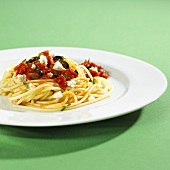 Spaghetti with olives, tomatoes and feta