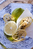 Fresh lemons and dried lemon slices