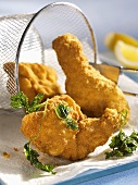 Viennese fried chicken with parsley on paper towel