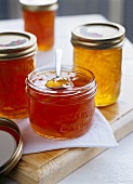 Different kinds of marmalade in jam jars