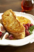French toast with maple syrup, raspberries and figs