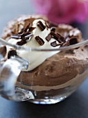 Mousse au chocolat with cream in a glass cup