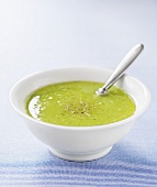 Cream of broccoli soup with spoon
