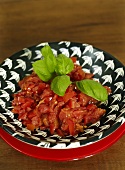 Tomatoes with basil and onion