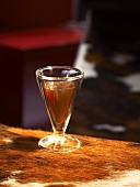 A shot glass of coffee with kirsch and cognac