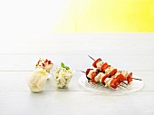 Grilled chicken kebabs with three different variations on polenta
