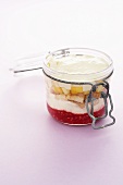 Coconut tiramisu with exotic fruit in a preserving jar