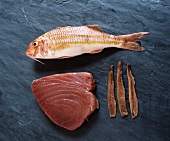 Anchovies, red mullet and tuna steak on granite