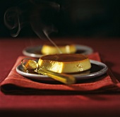 Two crème caramels with smoke