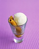 Lemon sorbet with wafer rolls in a glass
