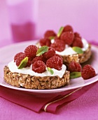 Wholemeal biscuits topped with yoghurt and fresh raspberries