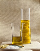 Lemon oil in a carafe with ingredients