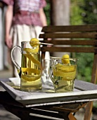 Home-made lemonade in jug and glass