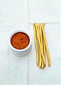 Grissini with red pepper and goat's cheese dip