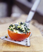 Baked tomato stuffed with Roquefort and spinach