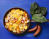 Warm, exotic fruit salad in a frying pan