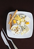 Plate of cheese with maple syrup dip