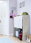 Cloakroom with storage space for household equipment
