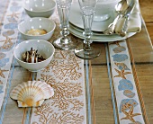 Tableware and shells on table