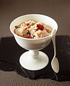 A dish of rice pudding with berries