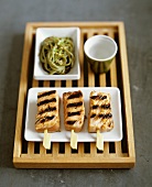 Grilled salmon skewers with noodles