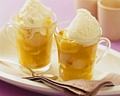 Exotic fruit compote with vanilla ice cream in two cups